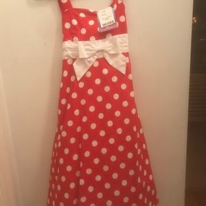 Red and white polka dot dress with white bow